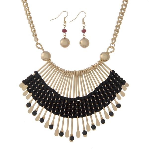 Wholesale gold necklace set displaying bohemian casting wrapped black cord