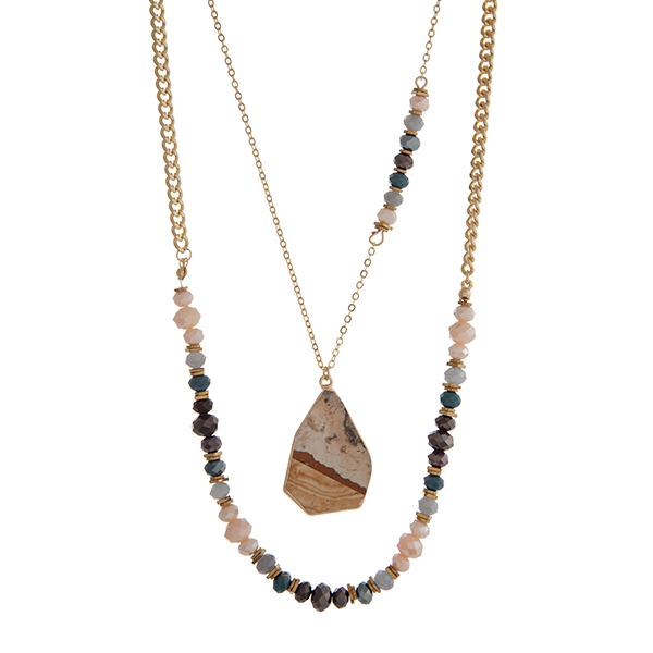 Wholesale gold layering necklace displaying ivory teal black glass beads brown n