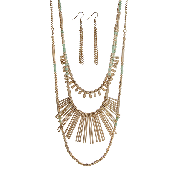 Wholesale gold layering necklace set displaying mint gold beads metal fringe