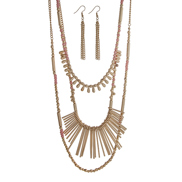 Wholesale gold layering necklace set displaying pink gold beads metal fringe