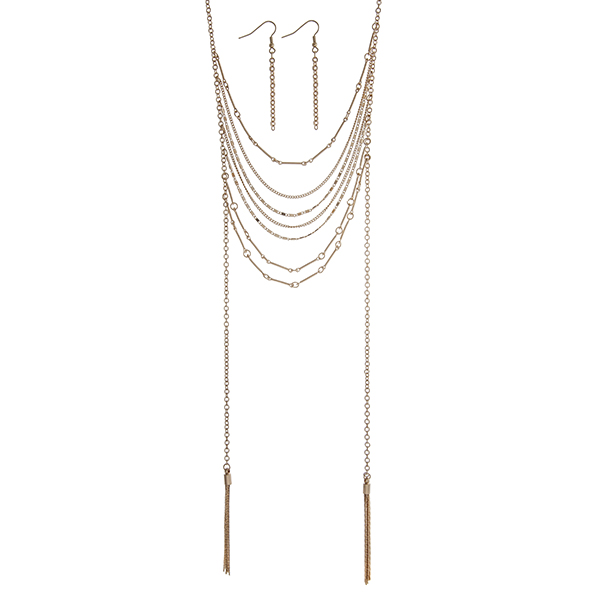 Wholesale gold layering necklace set displaying draped chains two metal tassels