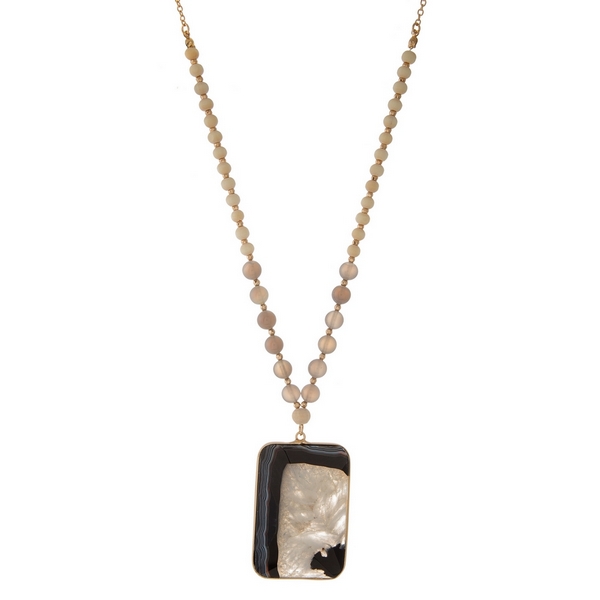Wholesale gold necklace displaying tan wooden beads gray beads black white natur