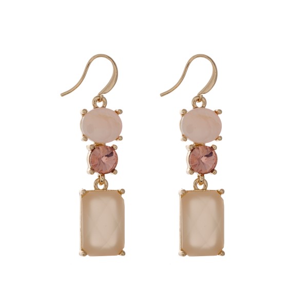 Wholesale gold fishhook earrings displaying pink oval cabochon pink rhinestone p