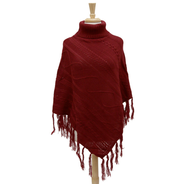 Wholesale knit turtleneck poncho fringe tassels along bottom hem cable knit patt